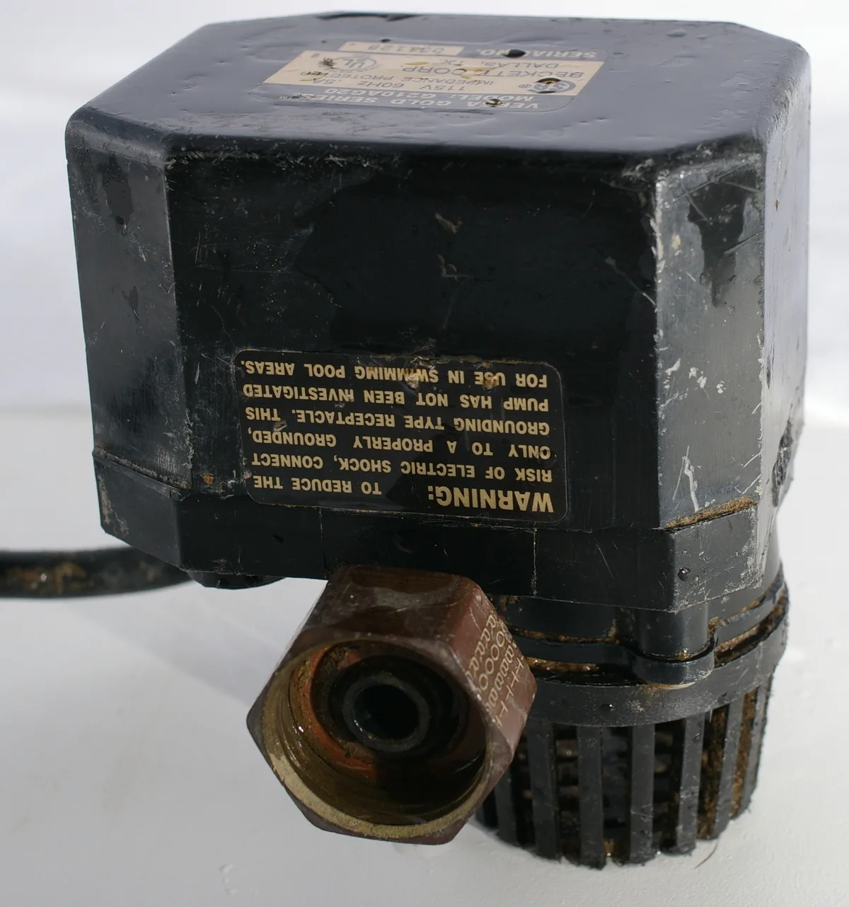 Sump pump installed in a basement floor pit